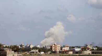 Smoke rises following an Israeli strike in the central Gaza Strip