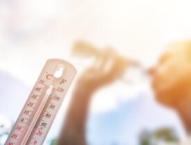 Man,Drinking,Water,In,Extreme,Heat,,Thermometer,In,Summer,Day