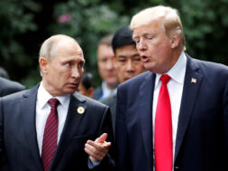 FILE PHOTO: U.S. President Donald Trump and Russia’s President Vladimir Putin talk during the family photo session at the APEC Summit in Danang