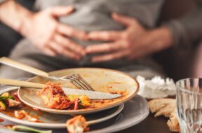 Woman,With,Bloating,And,Stomach,Pain,After,Eating